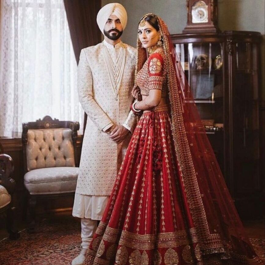 Bride and groom in traditional Indian attire for bridal and groom packages at Skinnish salon in Mangalore, Ullal, and Uppala
